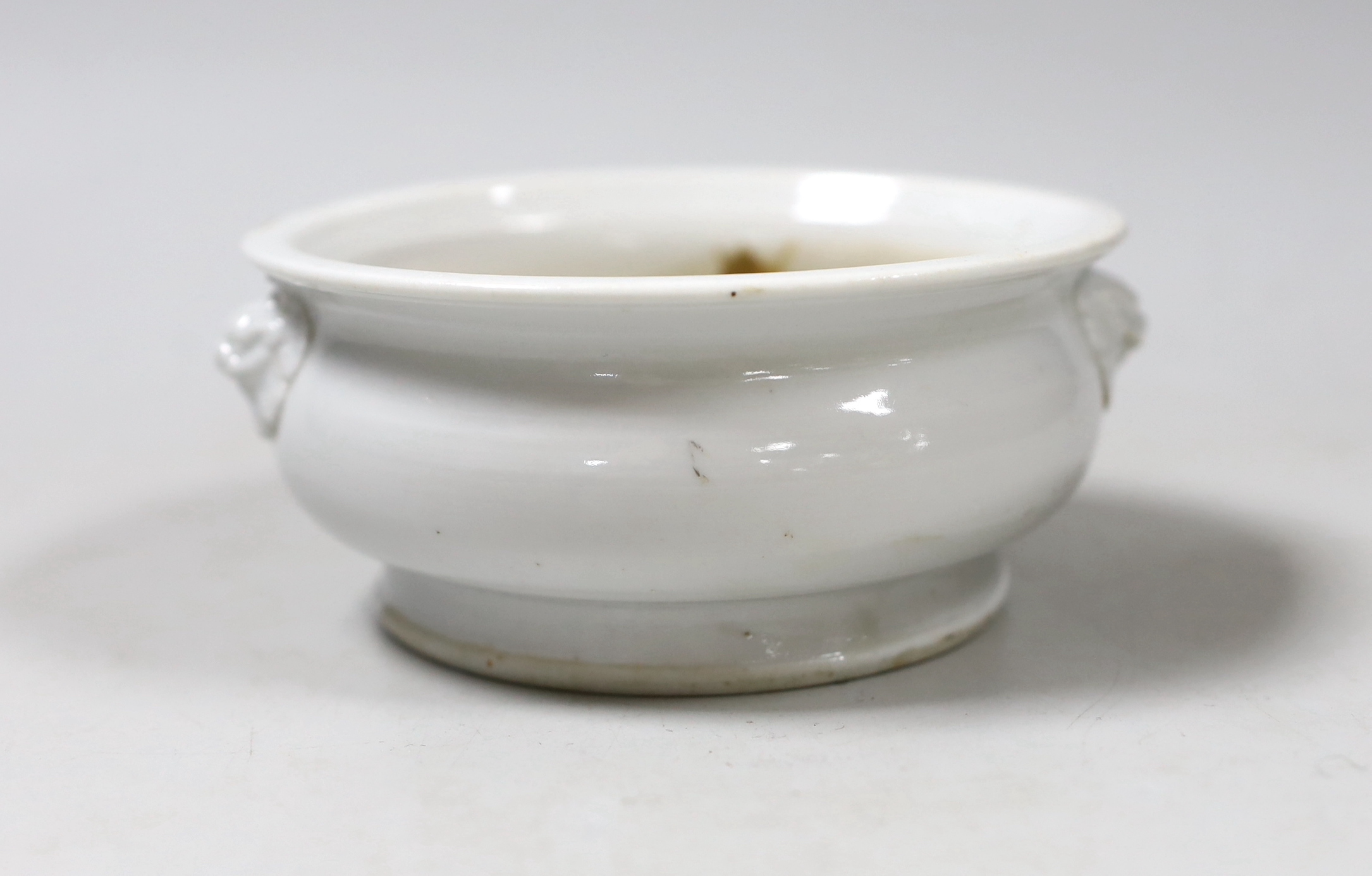 A Chinese blanc de chine two-handled censer, 12.5cm diameter